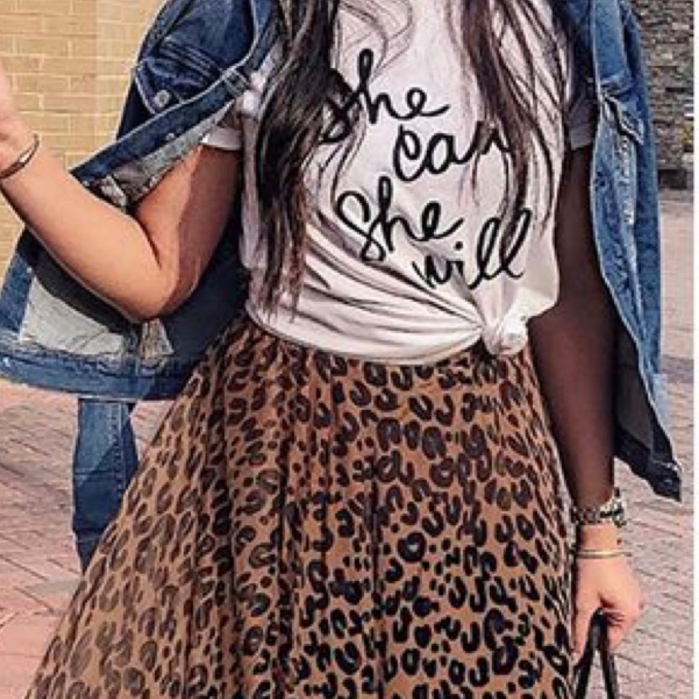 small white T with black raised letter detail